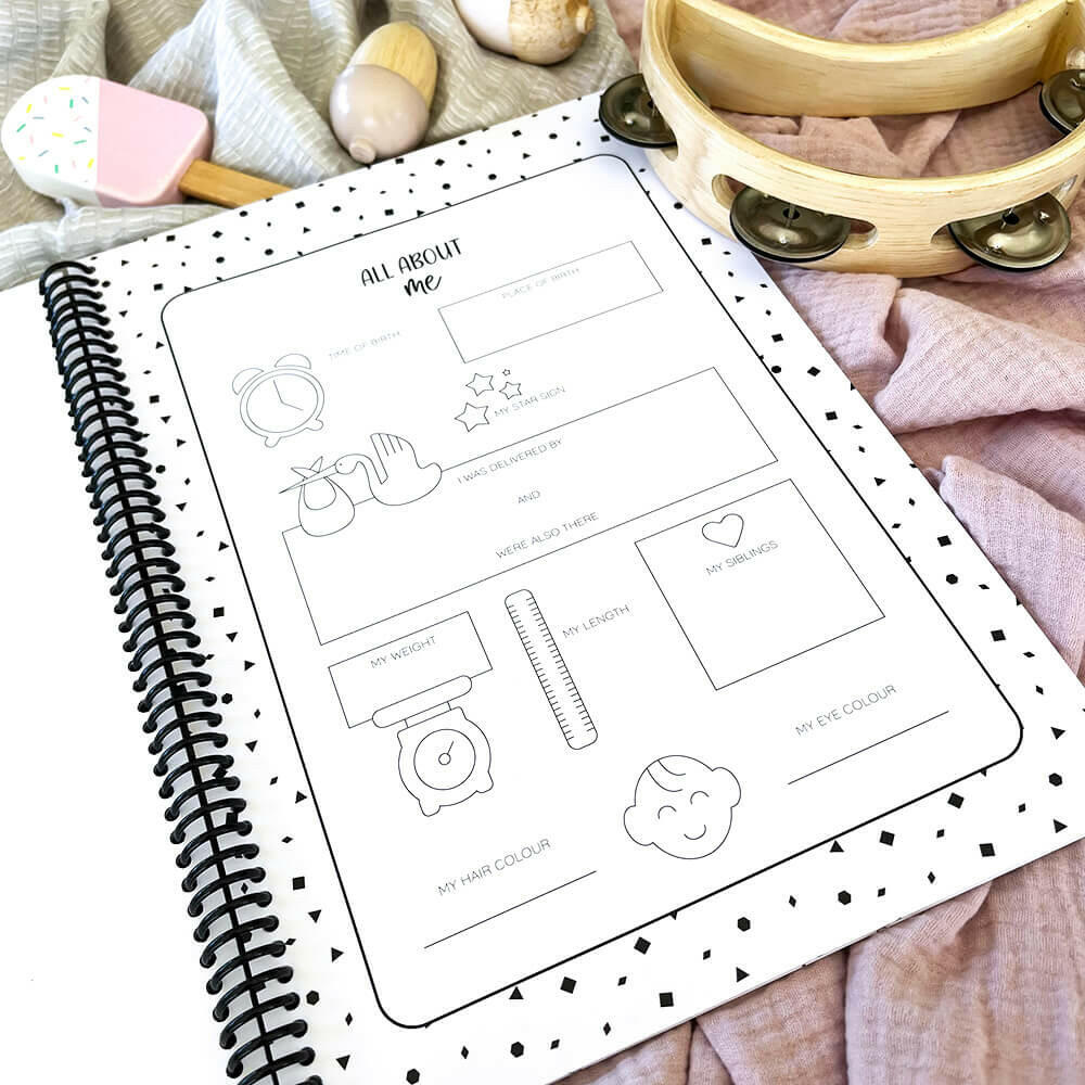Hey Baby baby milestone book open to About Me pages - baby memory book by Paper Heart Design