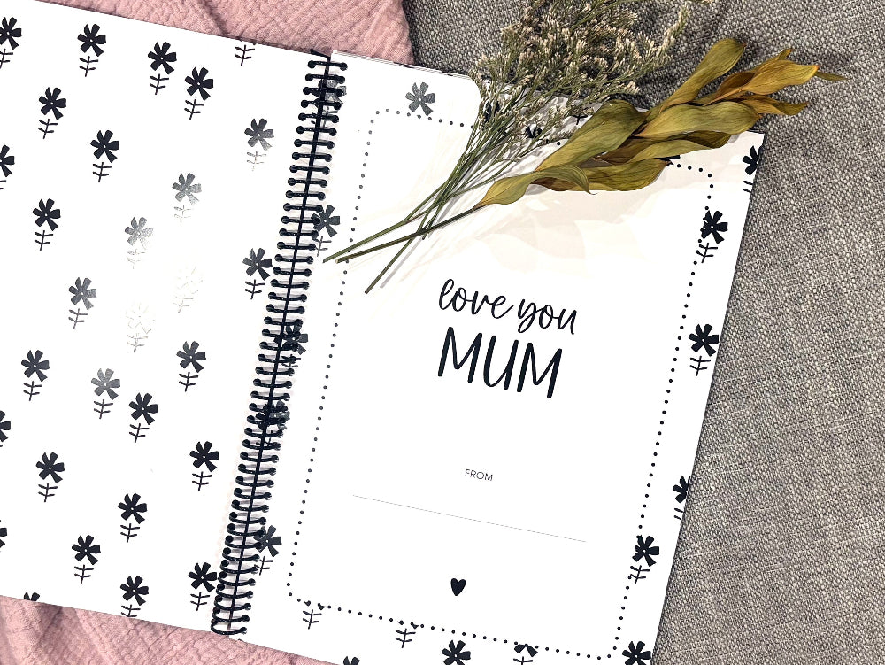 Letters to Mum keepsake book open to first page love you Mum flat lay on grey and pink fabric with dried flowers, by Paper Heart Design NZ