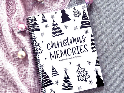 Christmas Memories keepsake book flat lay on pink background with Christmas decorations, by Paper Heart Design