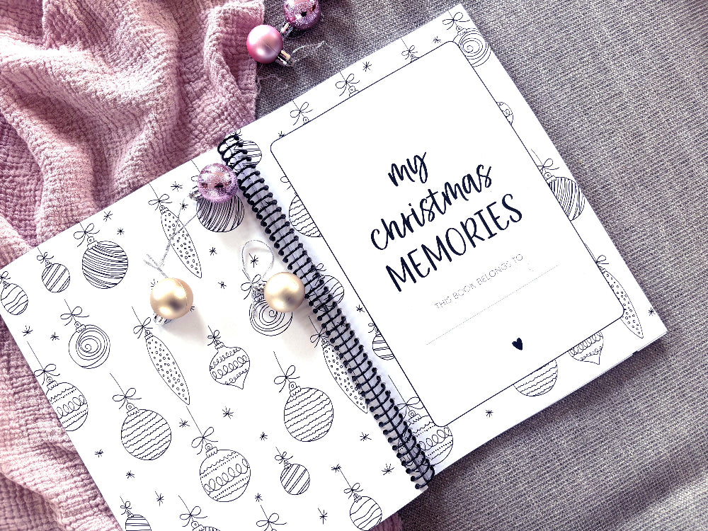 Christmas Memories keepsake book open to first page title flat lay with Christmas decorations, by Paper Heart Design