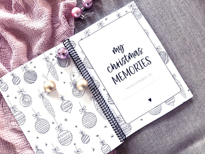 Christmas Memories keepsake book open to first page title flat lay with Christmas decorations, by Paper Heart Design