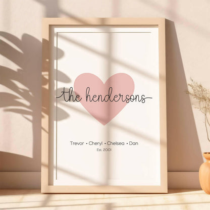 Family Script personalised family name print with marshmallow pink heart icon and black script font including established date, lifestyle image with plant shadows, by Paper Heart Design