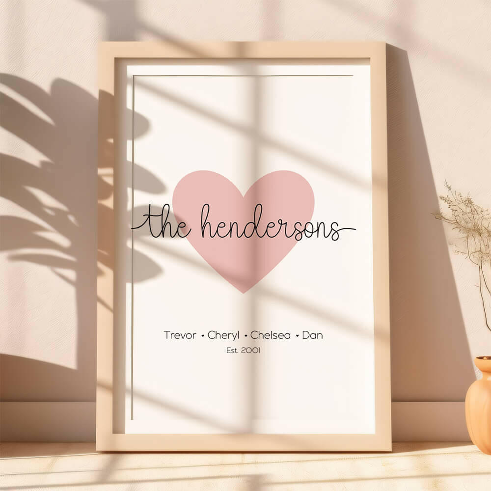 Family Script personalised family name print with marshmallow pink heart icon and black script font including established date, lifestyle image with plant shadows, by Paper Heart Design