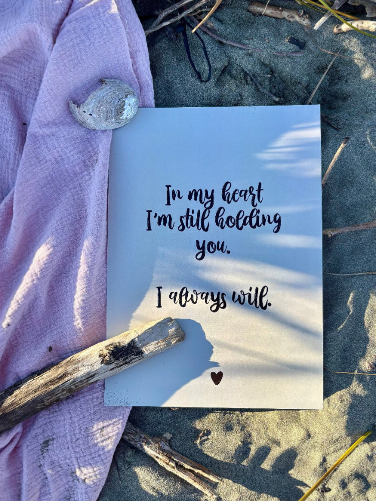 In My Heart memorial print flat lay on sandy beach with pink fabric, driftwood and shell, grief keepsake print by Paper Heart Design NZ