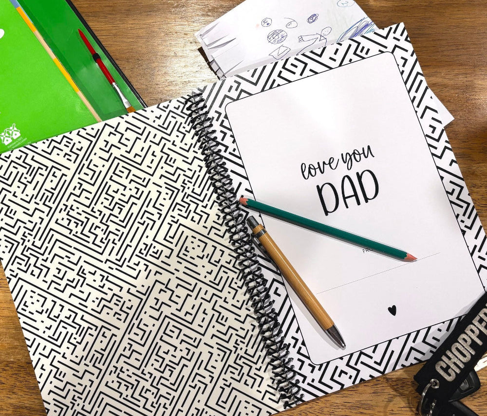 Letters to Dad memory book by Paper Heart Design, spiral-bound with a black and white cover, open to the title page with a child's drawing beside it