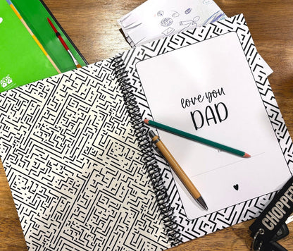 Letters to Dad memory book by Paper Heart Design, spiral-bound with a black and white cover, open to the title page with a child's drawing beside it