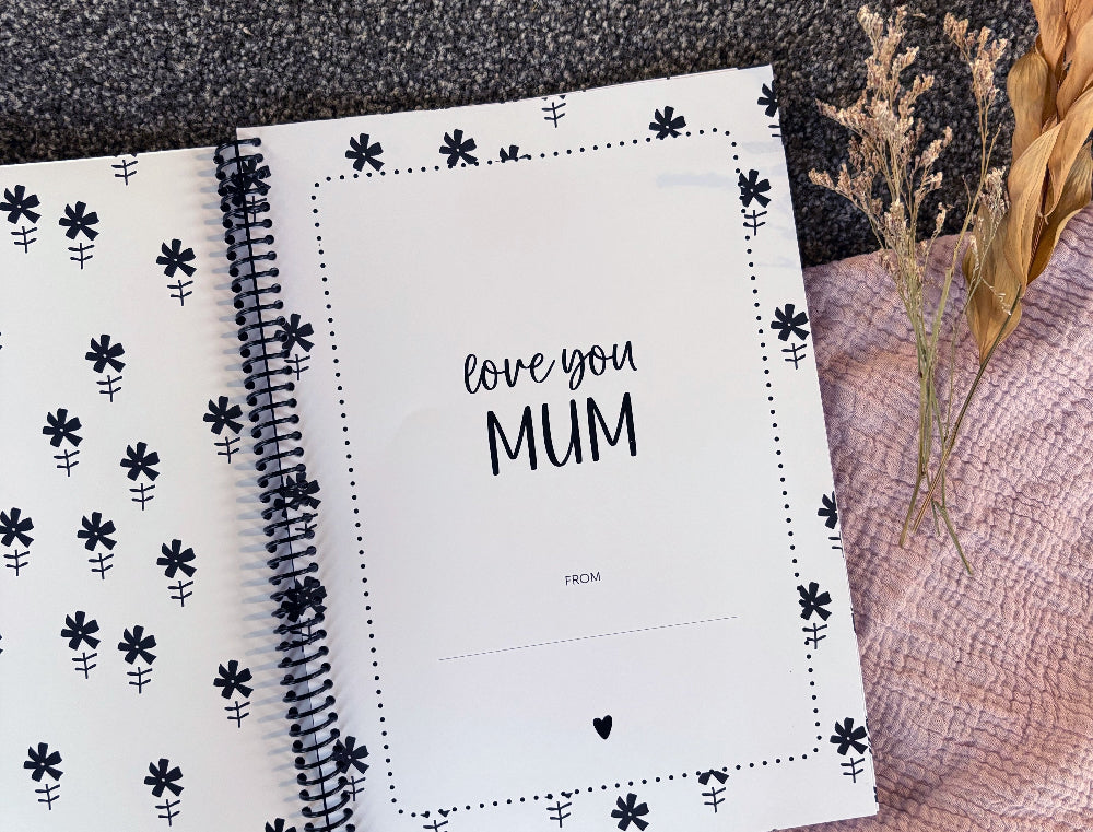 Letters to Mum keepsake book close up of first page love you Mum flat lay on grey and pink fabric with dried flowers, by Paper Heart Design NZ