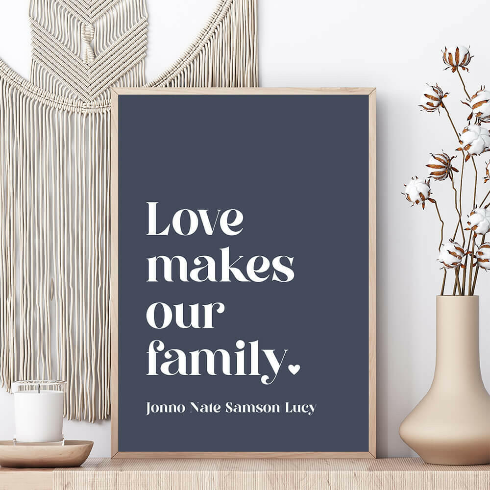 Love Makes Our Family personalised family print in dusk framed on shelf with vase beside and macrame wall hanging behind, by Paper Heart Design NZ