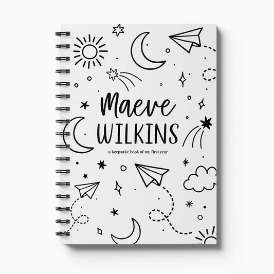 Personalised Hey Baby first year milestone book with stars and moons monochrome cover on white background, custom baby keepsake by Paper Heart Design NZ