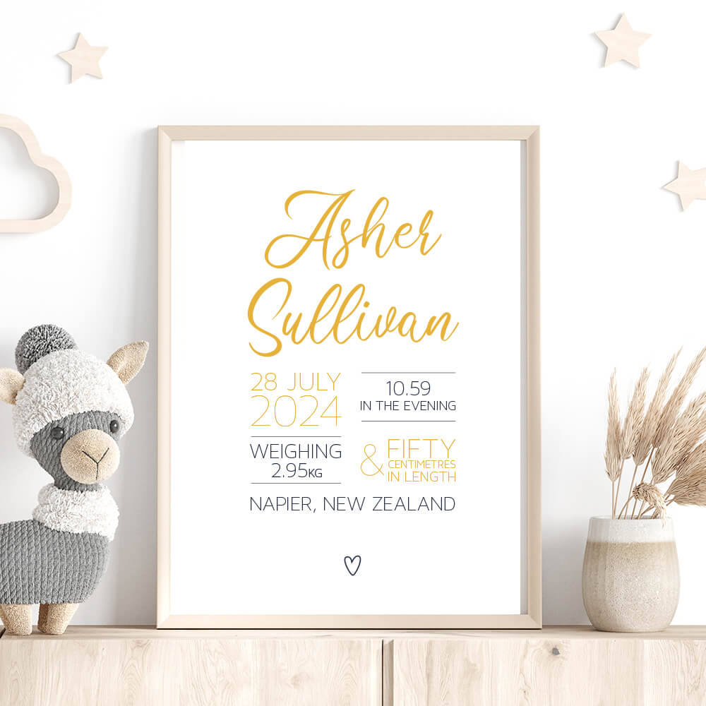 Script Birth Print personalised baby birth print in gold and navy framed on shelf with stars, stuffed toy and dried plant, nursery wall art by Paper Heart Design NZ