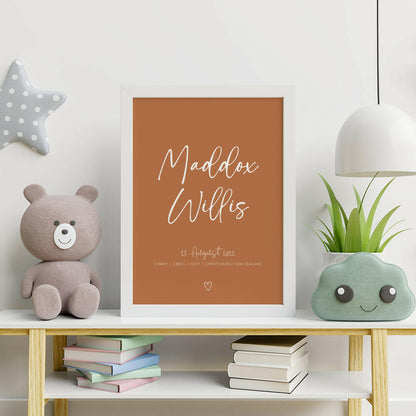 Signature Birth Print personalised baby birth print in white on clay framed on bookshelf with teddy, books, light and plant, nursery wall art by Paper Heart Design NZ