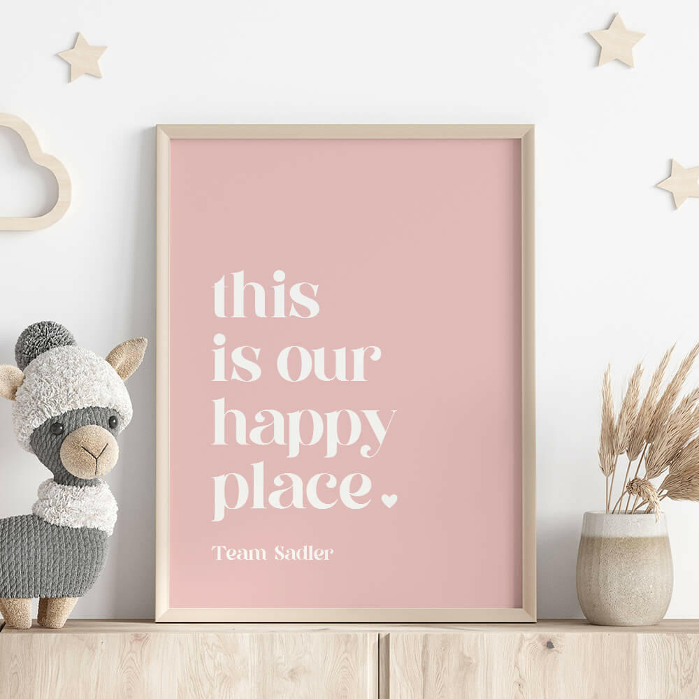This Is Our Happy Place personalised family print in marshmallow framed on shelf with llama stuffed toy, wooden stars on wall and vase with dried plant, by Paper Heart Design NZ
