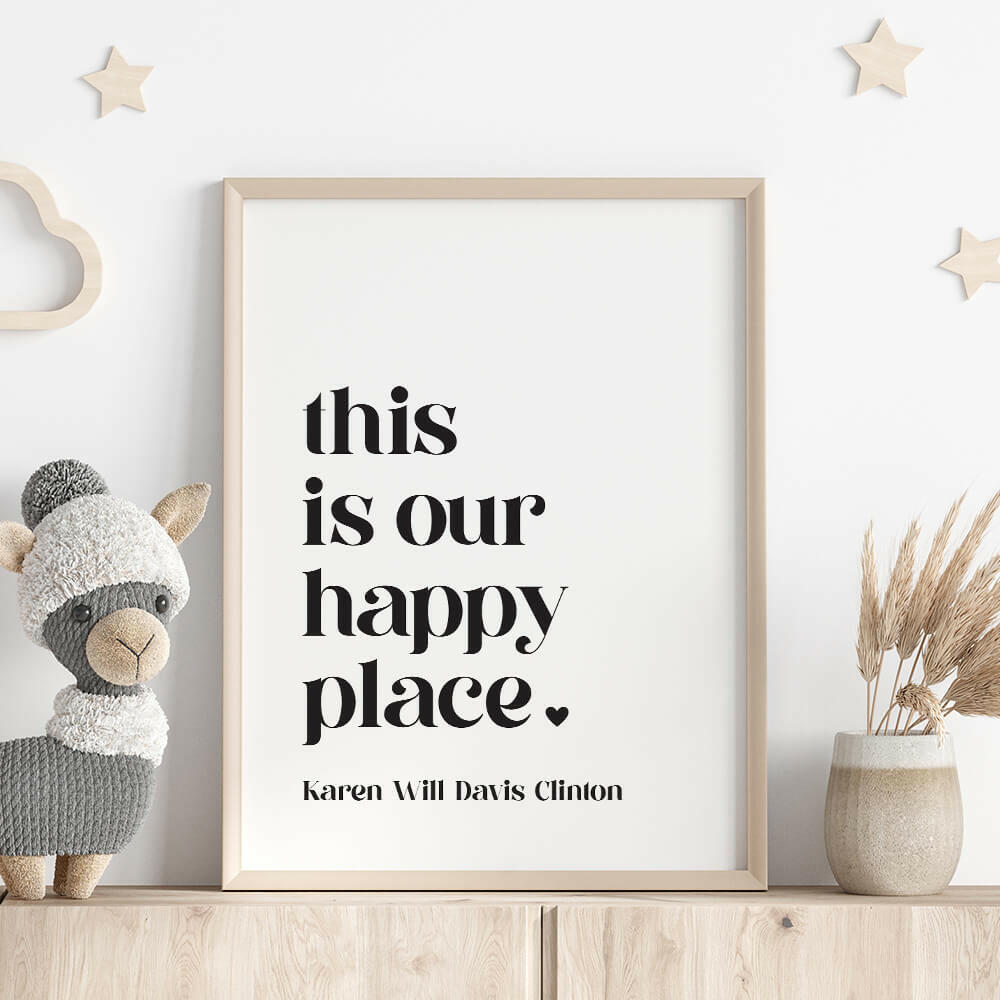 This Is Our Happy Place personalised family print in white with black text framed on shelf with llama stuffed toy, wooden stars on wall and vase with dried plant, by Paper Heart Design NZ