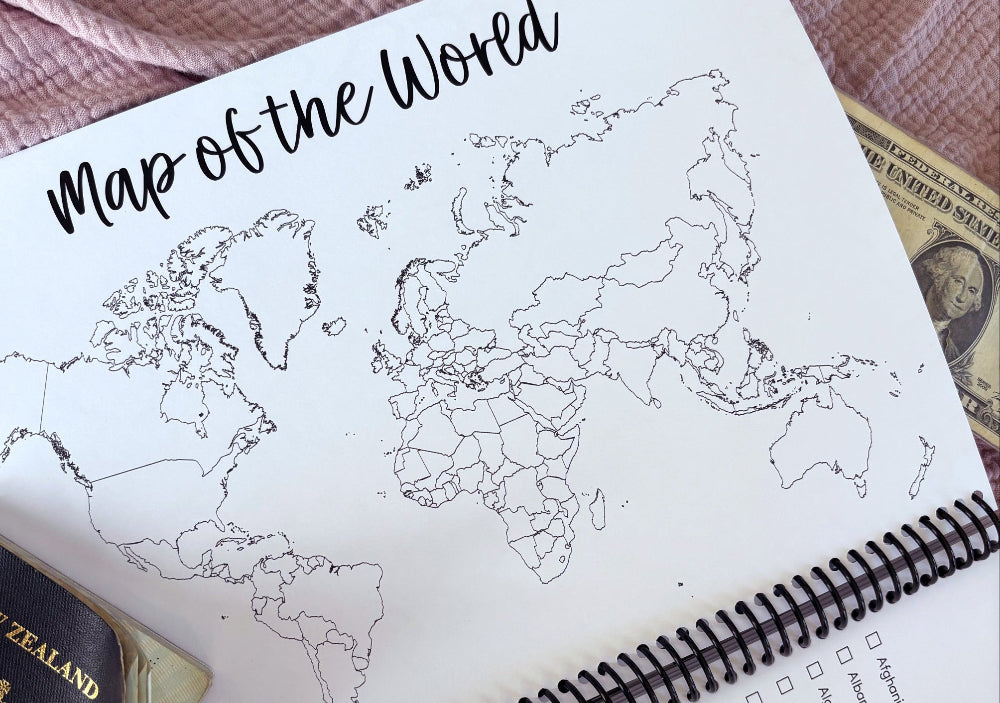 Travel Adventures keepsake journal close up of monochromatic line drawing world map on pink textured background, by Paper Heart Design NZ