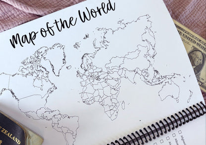 Travel Adventures keepsake journal close up of monochromatic line drawing world map on pink textured background, by Paper Heart Design NZ