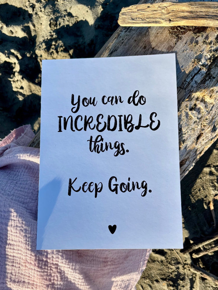 You Can Do Incredible Things print in black on white flat lay on sand and pink fabric with driftwood, Hope Collection by Paper Heart Design NZ