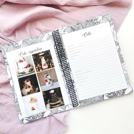 You and Me wedding planner open to cake inspiration pages with cake photos on pink and grey textured background, by Paper Heart Design NZ