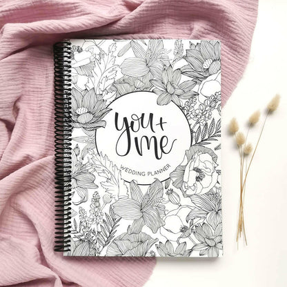 You and Me wedding planner front cover flat lay with dried bunny tails on pink textured background, engagement gift by Paper Heart Design NZ